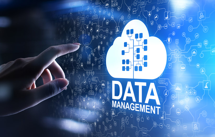 Data Management image with hand pointing toward screen of data charts